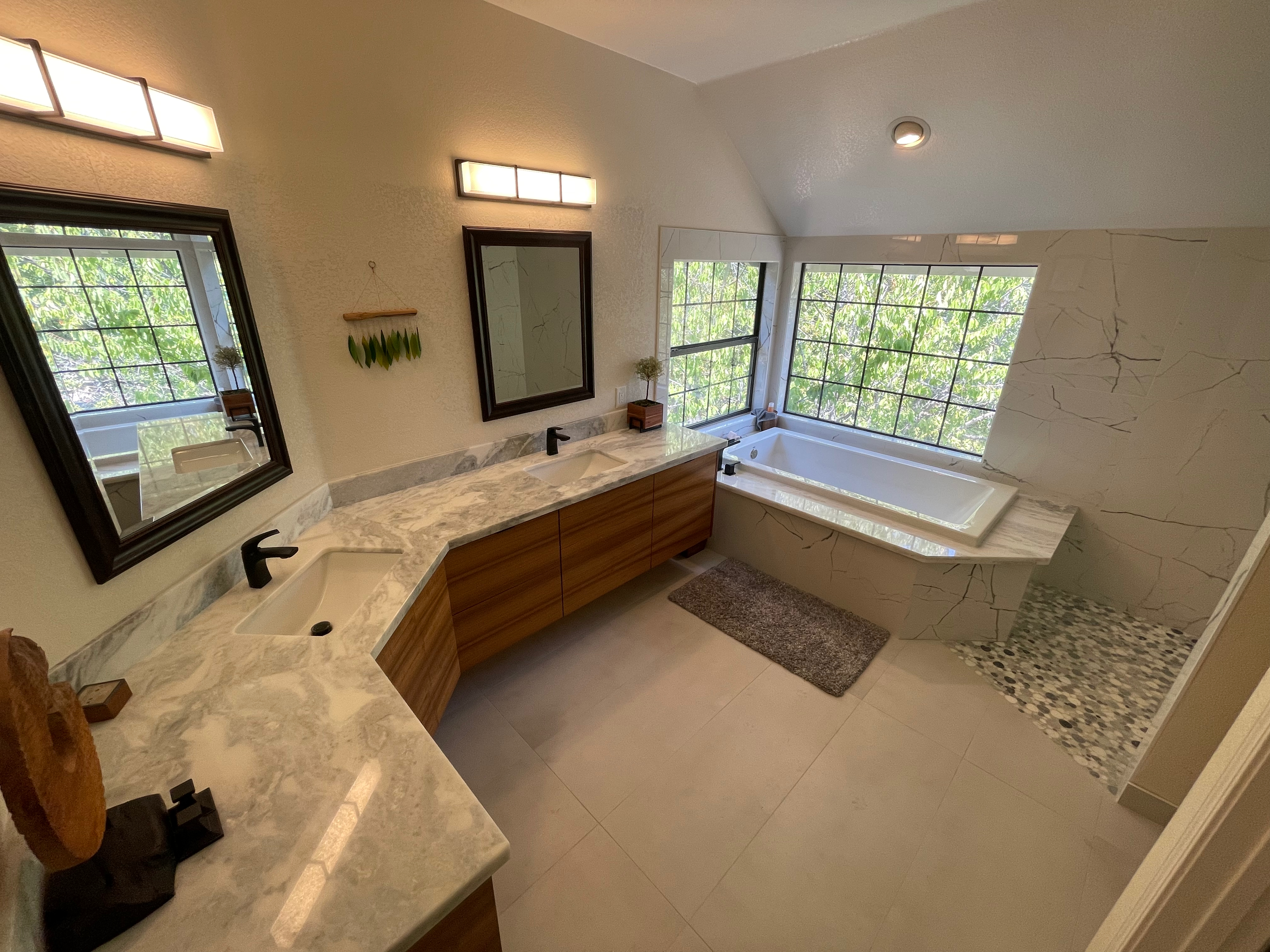 Marble vanity and tub surround with natural light